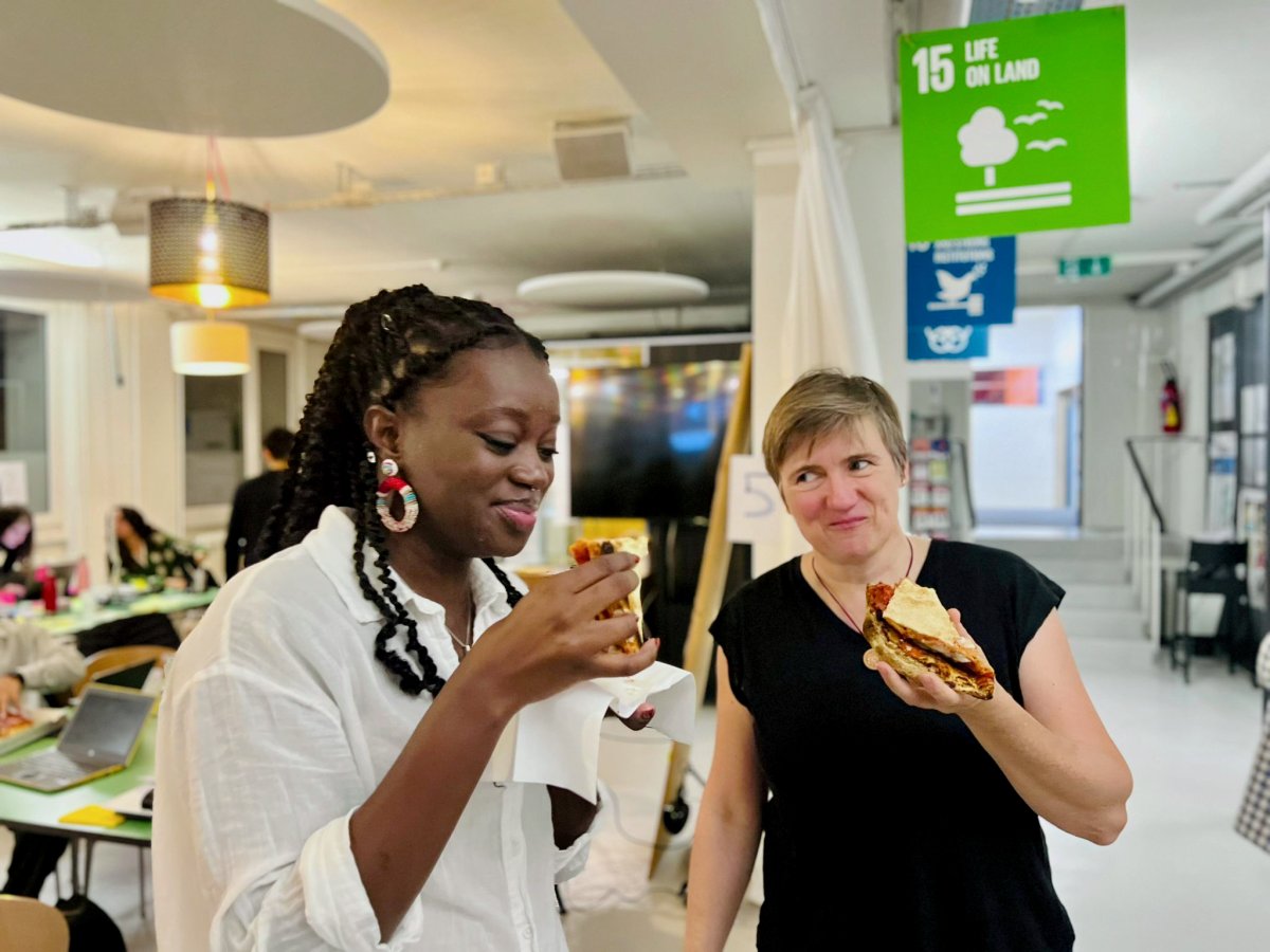 A well-deserved pizza break for Sally Sow, UNIGE-student, and Kerstin Preuschoff as they continue hacking